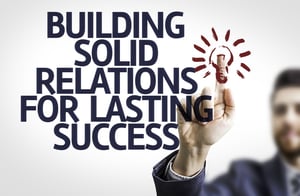 Business man pointing to transparent board with text Building Solid Relations For Lasting Success-1