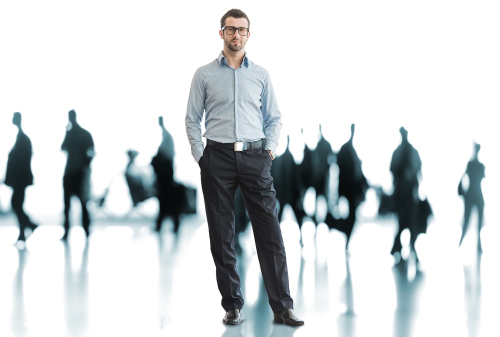 One business man standing in front of crowd